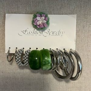 Set of 5  pairs of earrings with 1 green marbelized pair. 4 pr of silver toned